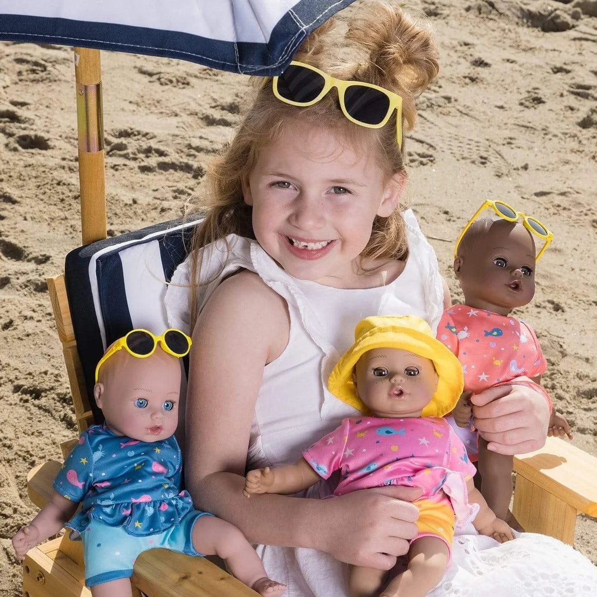 Adora Beach Babies Sunny toy doll with a cheerful beach-themed design and sunny yellow outfit