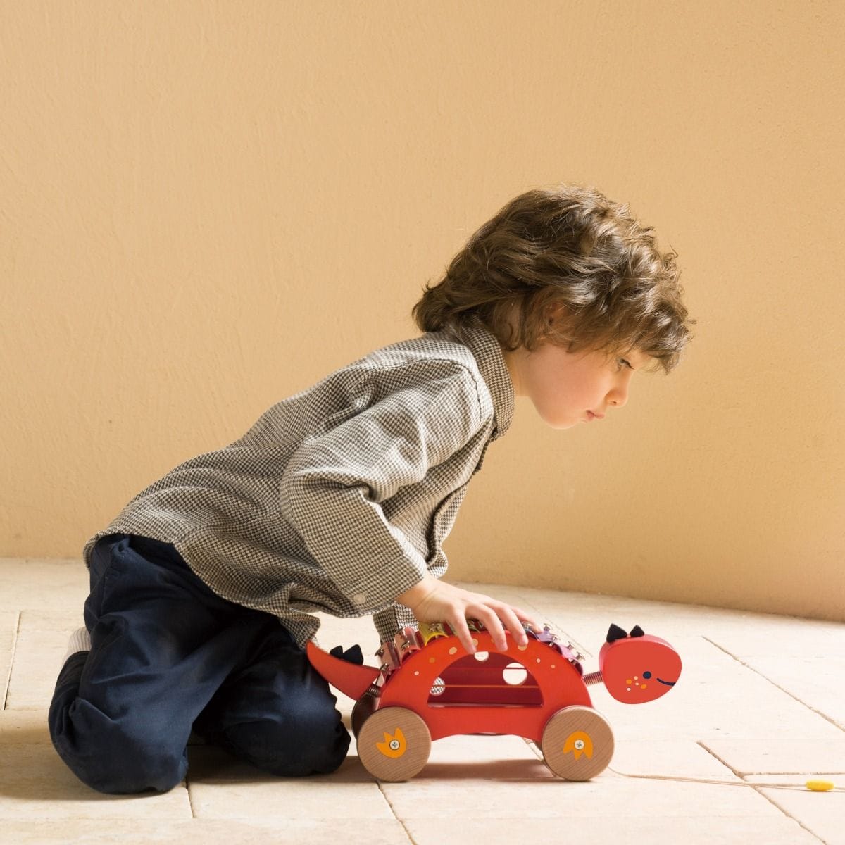 Colorful Dinosaur Xylophone toy by Classic World featuring rainbow-colored keys and a cheerful dinosaur design for kids.