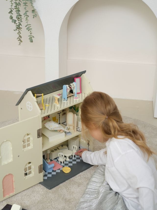 Vintage wooden dolls house by Classic World featuring detailed miniature rooms and classic toy craftsmanship.