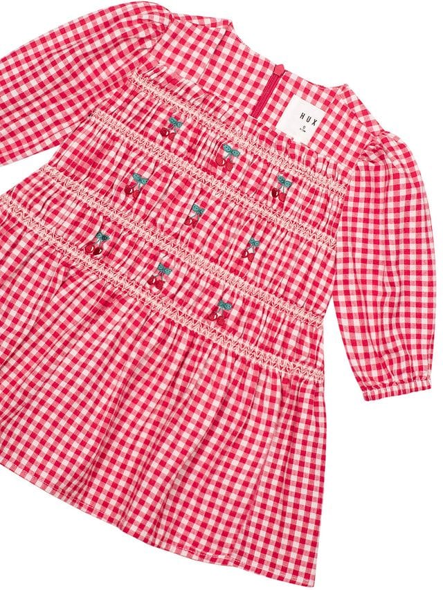 Girls Cherry Check Dress by Huxbaby featuring a stylish red and white check pattern and comfortable design for everyday wear.