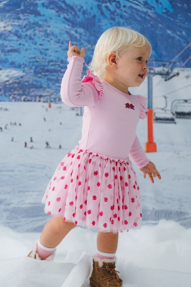 Girls dress by Huxbaby featuring rose embroidery on delicate tulle fabric, perfect for special occasions.