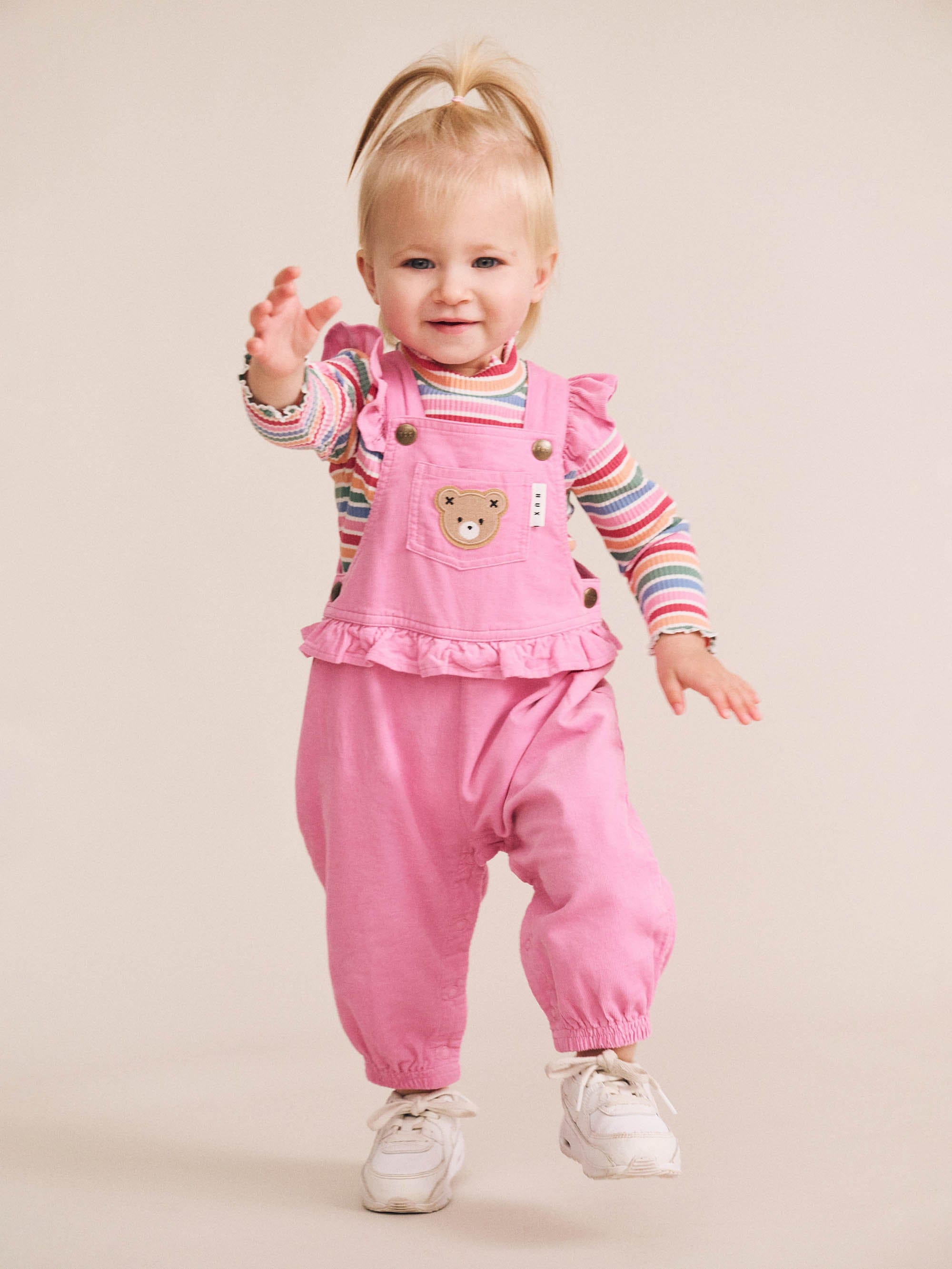 Girls rib skivvy with colorful tutti frutti stripe pattern from Huxbaby, featuring a snug fit and soft ribbed fabric.