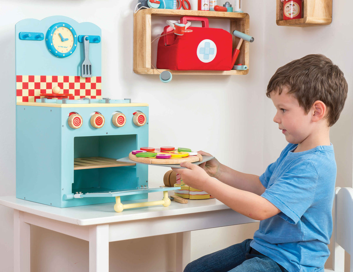 Le Toy Van Create Your Own Pizza wooden toy set with colorful pizza toppings and serving pieces