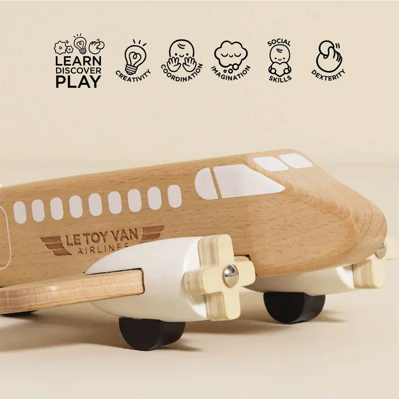 Le Toy Van wooden toy plane in natural wood finish, children’s toy aircraft viewed from the side