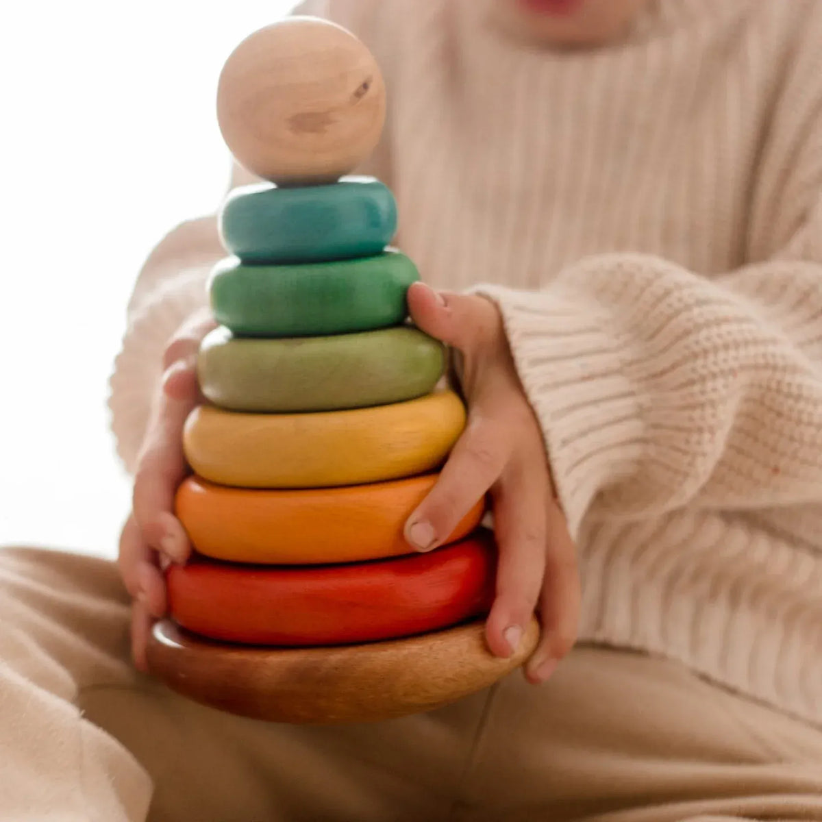Q Toys bouncing stacking rings toy with colorful rings in various sizes, designed for children’s play and development.
