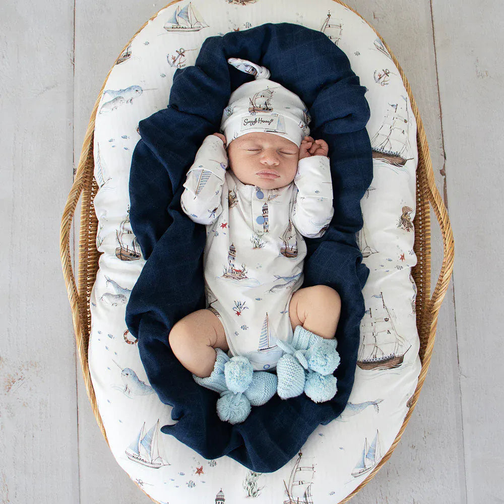 Snuggle Hunny Kids boys long sleeve organic bodysuit with a sailboat print, designed as a comfortable, stylish onesie for boys.