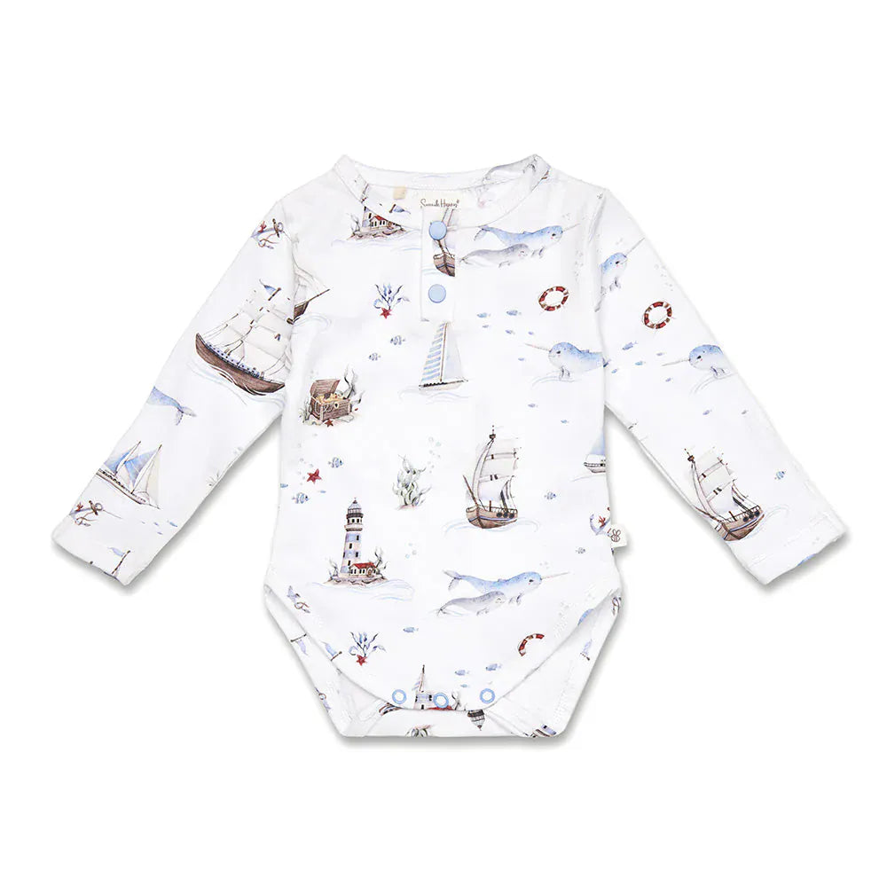 Snuggle Hunny Kids boys long sleeve organic bodysuit with sailboat print, soft fabric, designed for comfort and everyday wear.
