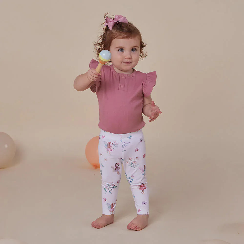 Girls Fairy Garden Organic Leggings by Snuggle Hunny Kids, featuring colorful fairy and garden print, made for comfortable wear.