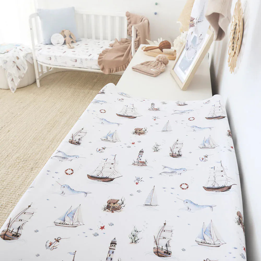 Snuggle Hunny Kids Set Sail organic linen bassinet sheet and change pad cover with nautical sailboat pattern.