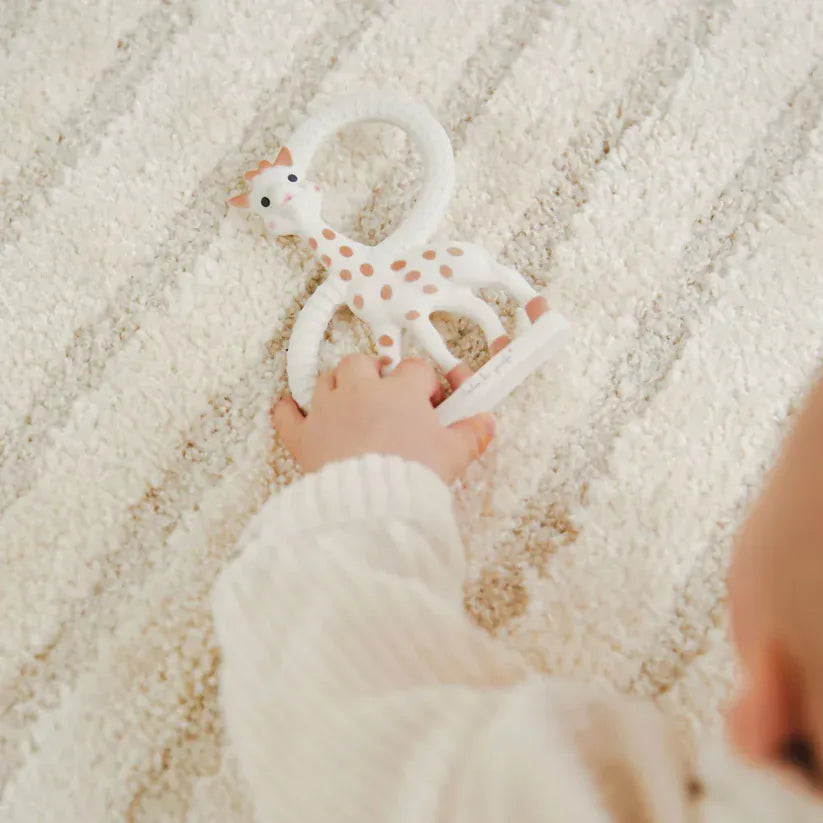 Sophie la Giraffe teething ring for babies, soft silicone and natural rubber, designed to soothe sore gums and promote teething comfort.