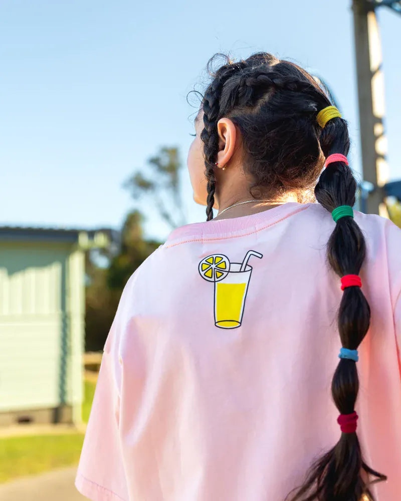 Pink Lemonade Tee for girls by The Girl Club, casual pink top with lemonade graphic, perfect for everyday wear.