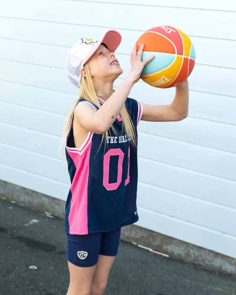 Girls' basketball tank top by The Girl Club, featuring a sporty design and comfortable fit for active wear.