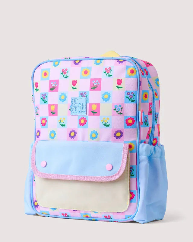The Adventure Backpack by The Somewhere Co. in Tulip Twirl design, showing a colorful, stylish bag with adjustable straps and multiple compartments.