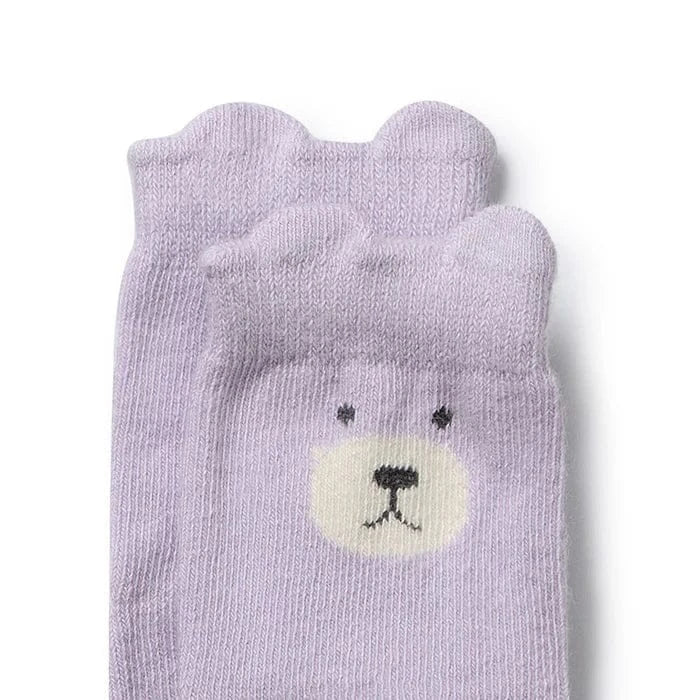 Girls organic baby socks from Wilson & Frenchy, set of four soft, breathable accessory socks for infants with colorful patterns.