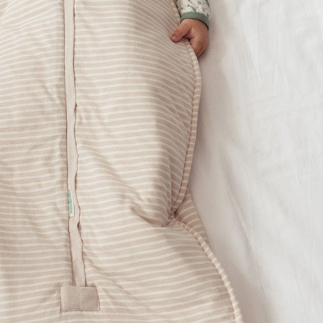 Woolbabe linen duvet front zip sleeping bag in Dune color, suitable for 3-24 months, featuring a cozy, soft fabric and front closure.