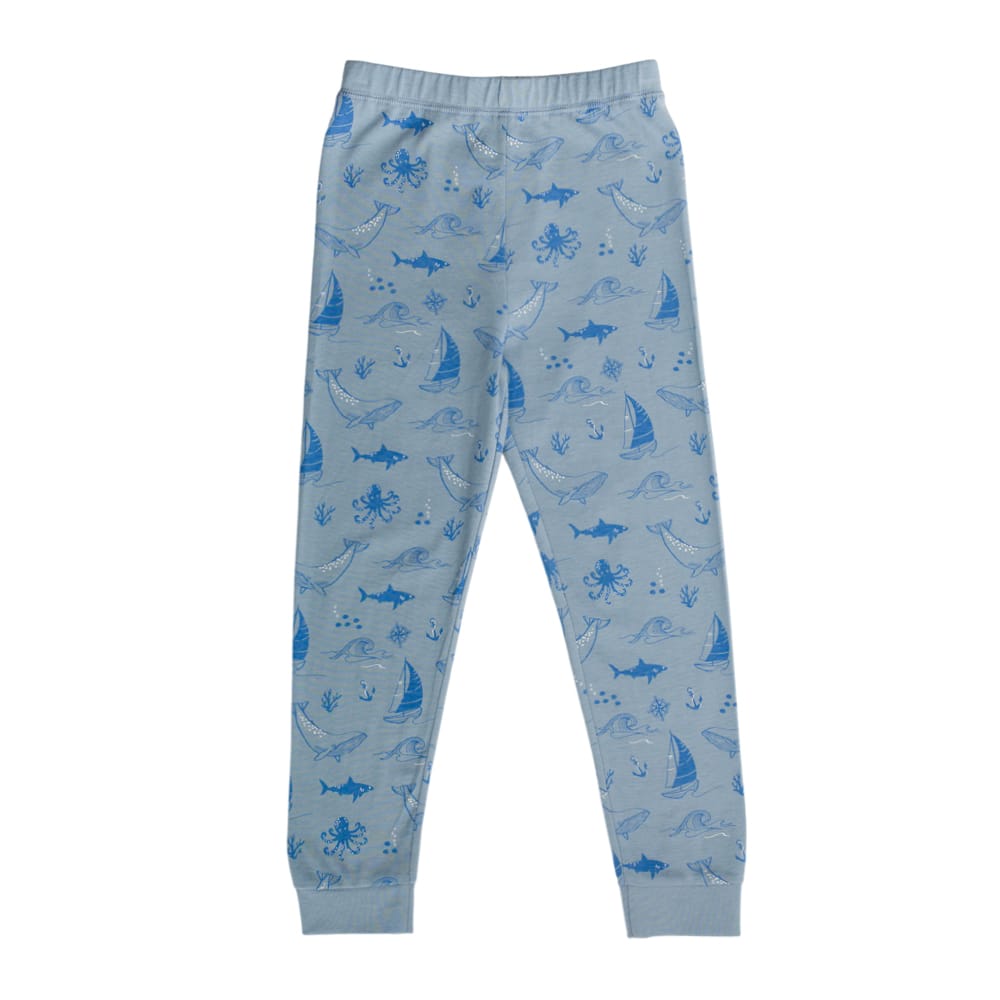 Unisex Woolbabe Merino and organic cotton winter pajamas in Glacier Sail Away design, cozy sleepwear for cold nights.
