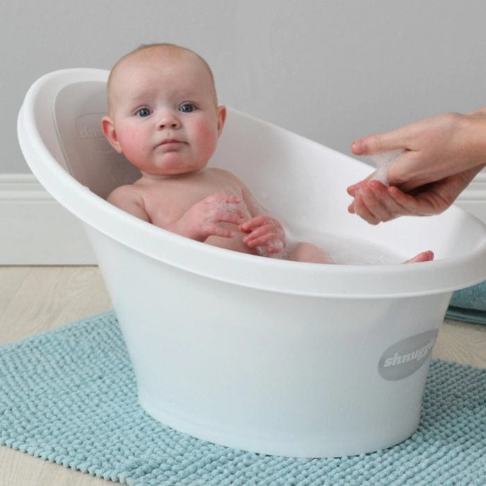 Shnuggle Bath for babies, soft foam tub with rounded edges and a gentle incline, designed for safe, comfortable bathing.