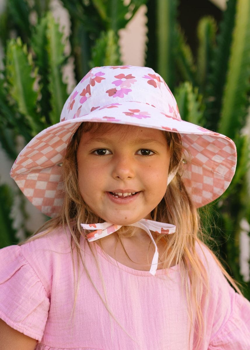 Coral Bloom reversible wide brim sunhat for kids by Acorn Kids, featuring sun protection and stylish, vibrant coral floral pattern.