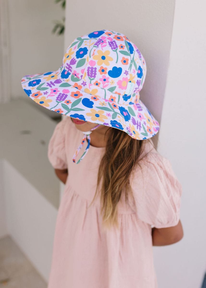 Bright pink Petal Pop Wide Brim Sunhat by Acorn Kids, featuring a floral design and wide brim for sun protection.