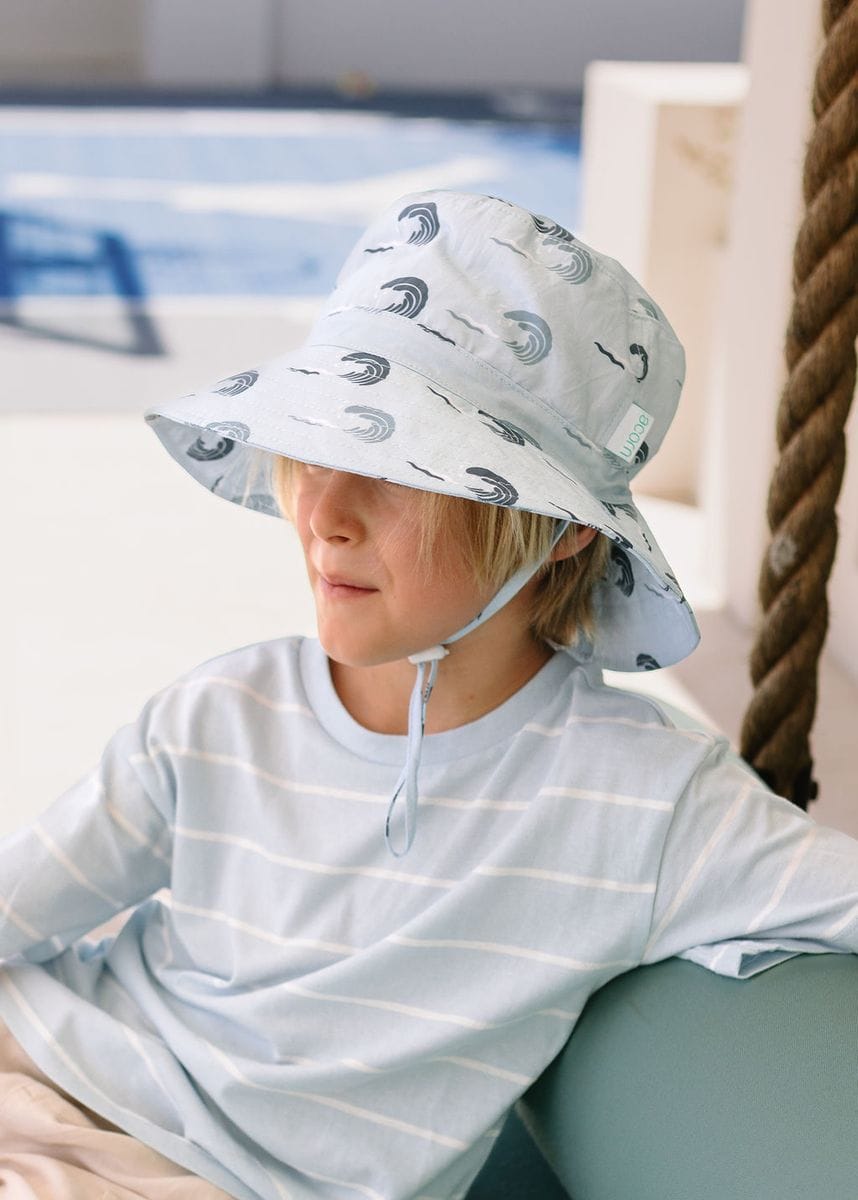 Kids wearing Acorn Kids Wave Curl Wide Brim Bucket Hat, stylish accessories hat with a wide brim for sun protection.
