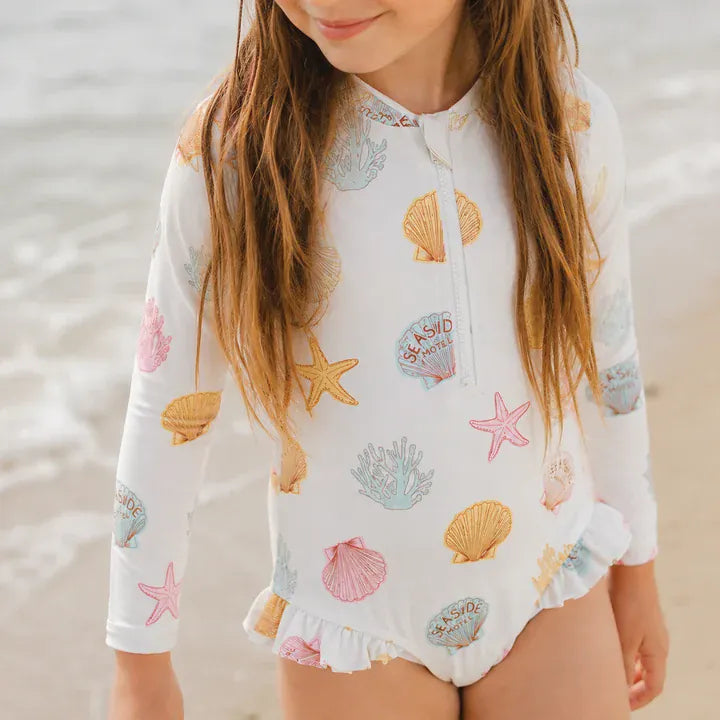 Crywolf Shell long sleeve swimsuit in a neutral shell print