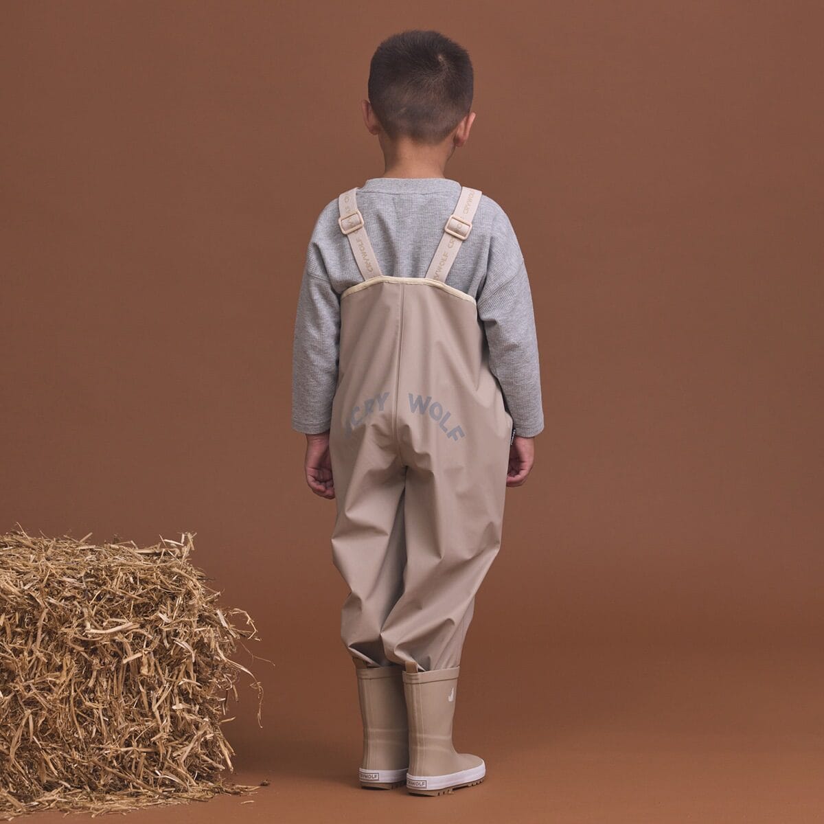 Crywolf unisex rain overalls in ash color, made for waterproof protection, featuring adjustable straps and durable fabric.