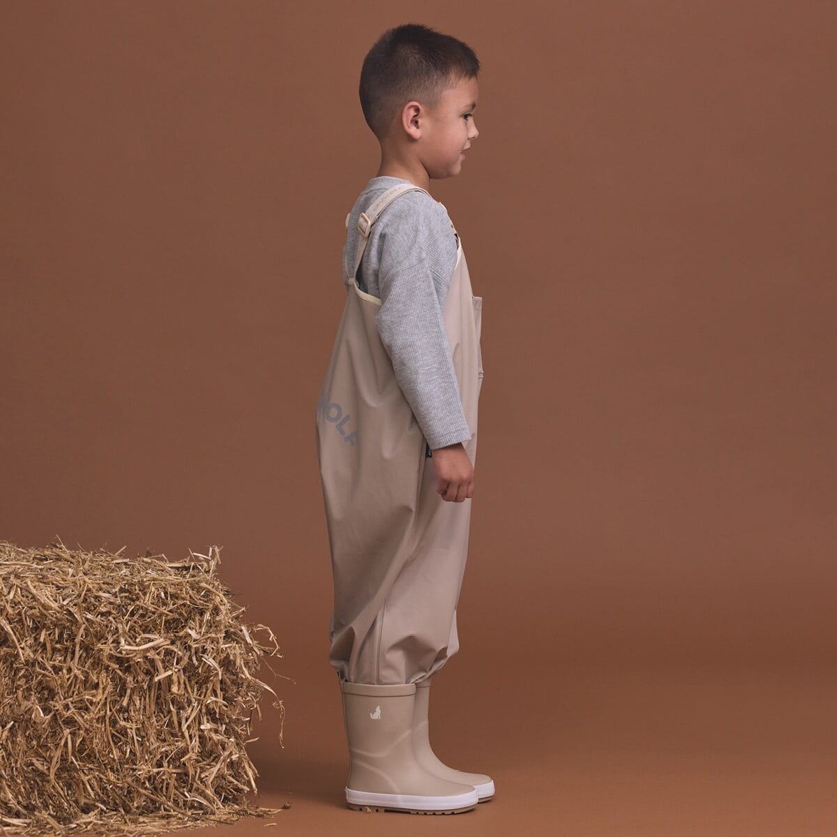 Crywolf unisex rain overalls in ash color, waterproof pants with adjustable straps and durable fabric for wet weather protection.