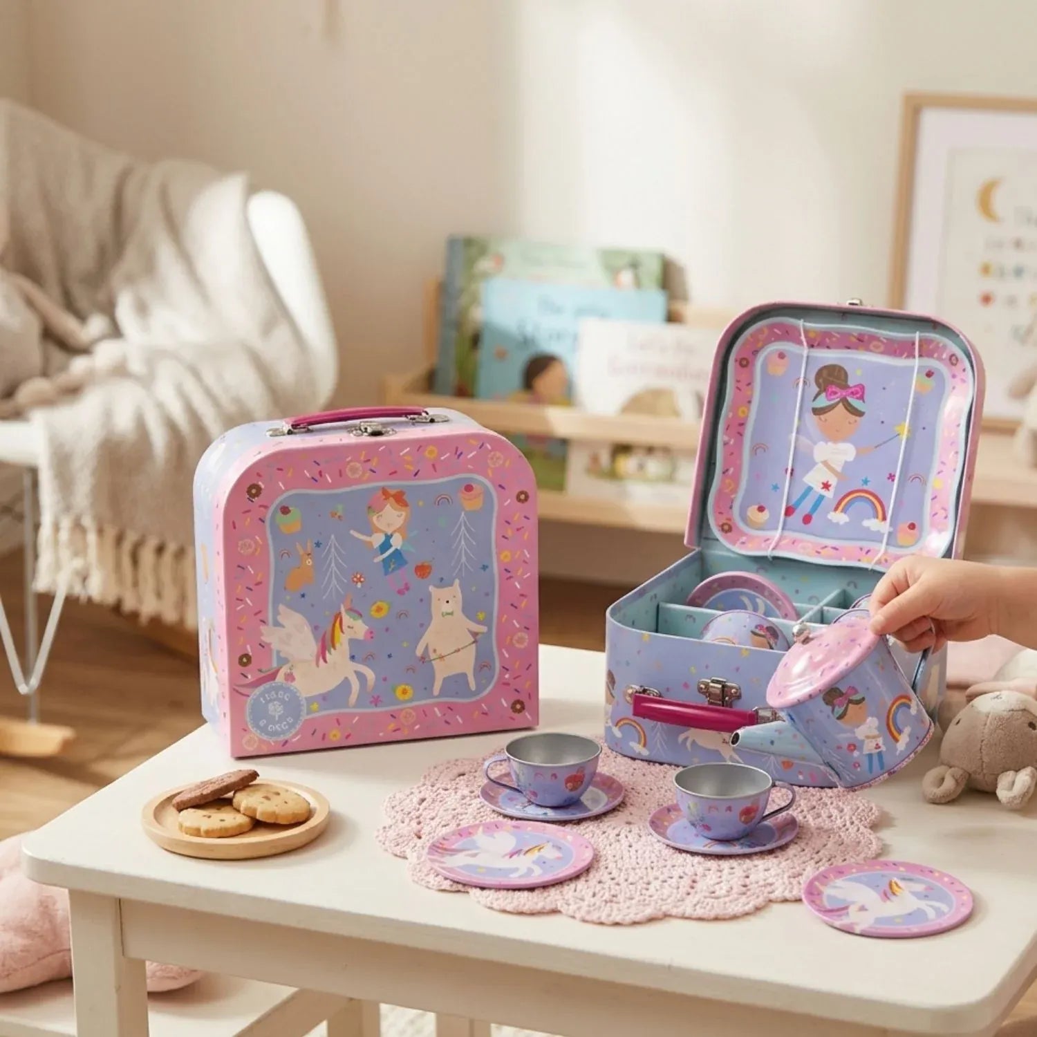 Colorful Rainbow Fairy tin tea set with 7 pieces from Floss & Rock, includes teapot, cups, and utensils for pretend play.