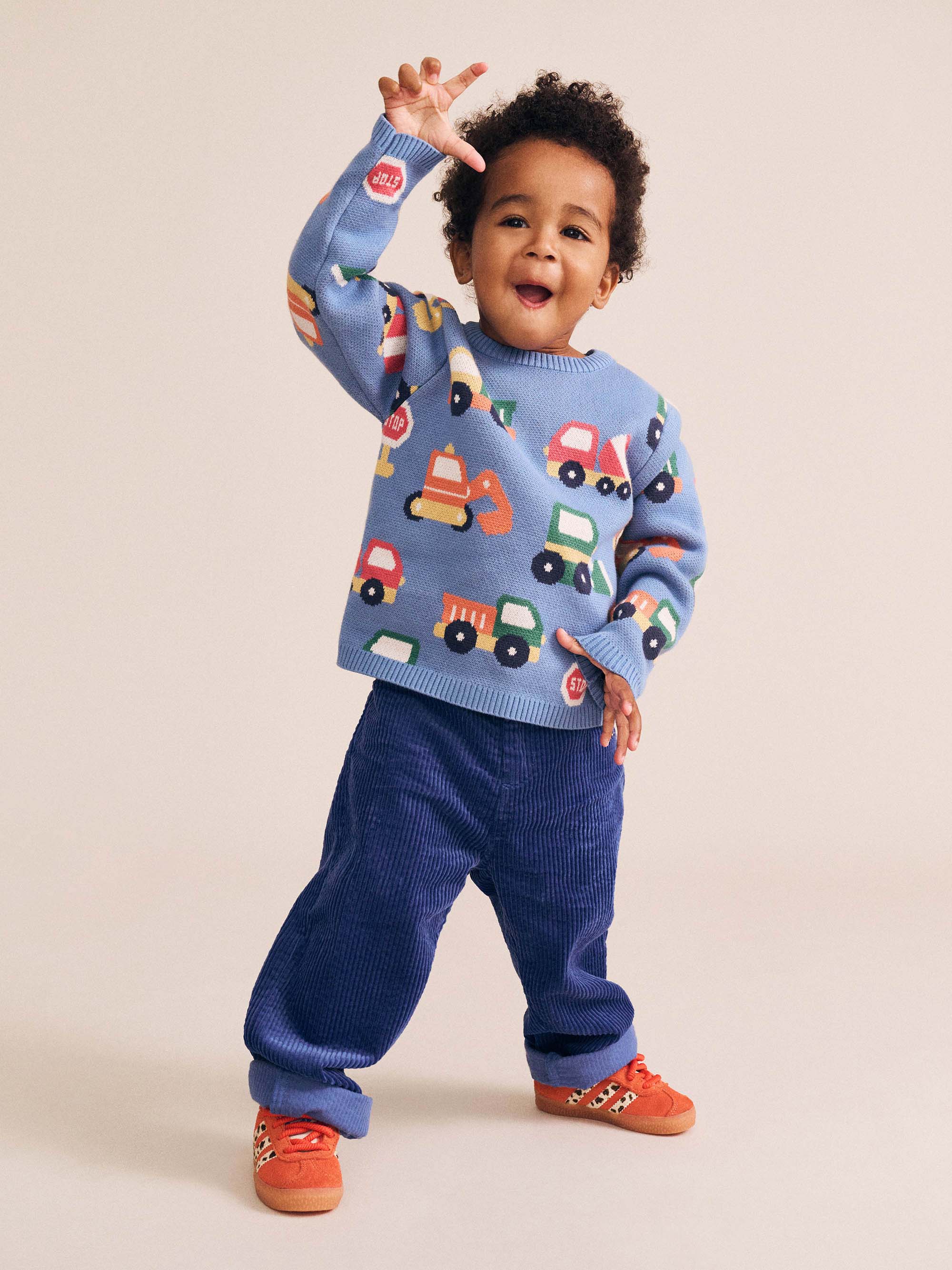 Huxbaby boys' construction pullover featuring colorful construction vehicle illustrations on soft fabric.
