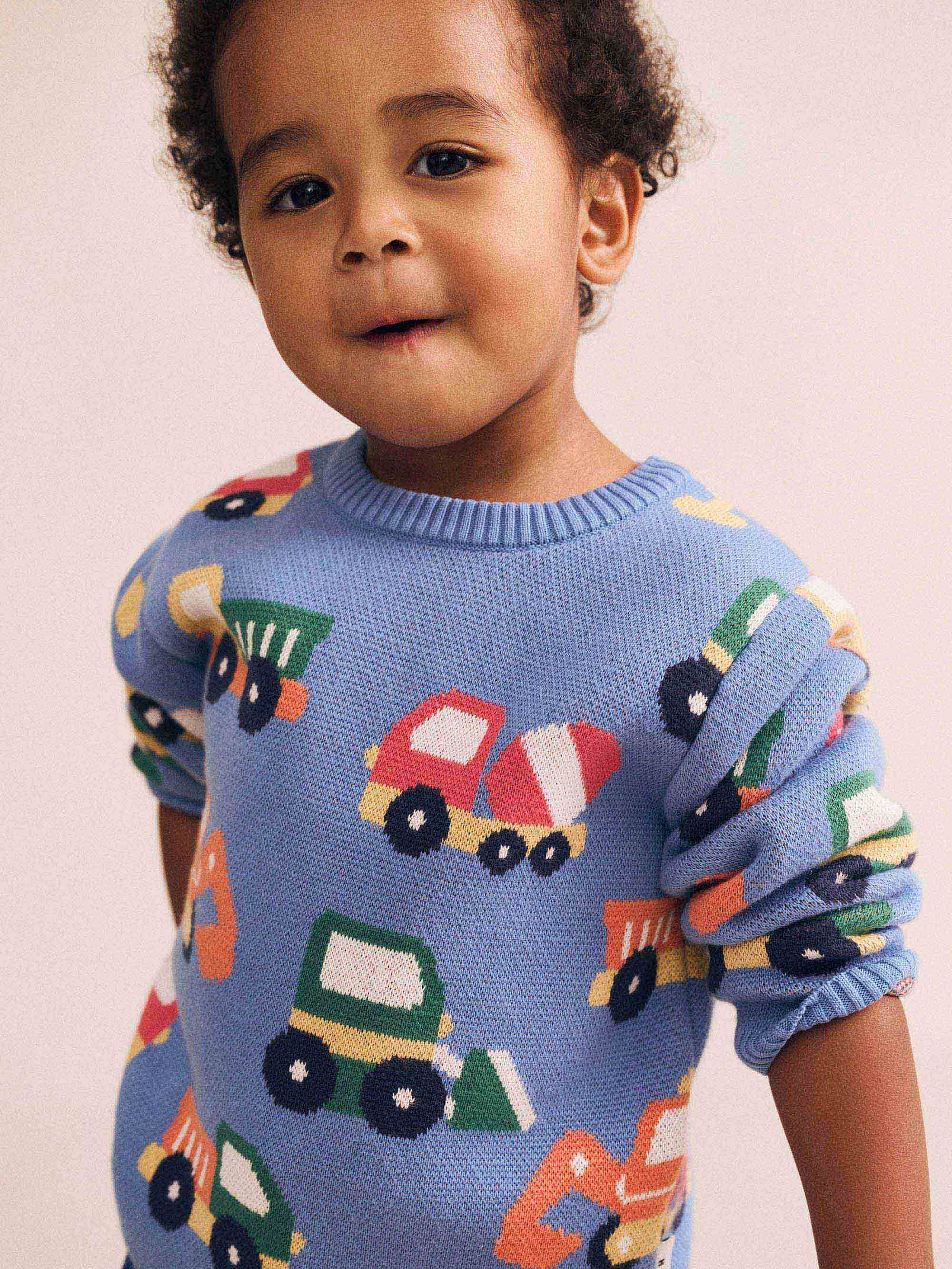 Huxbaby boys' construction pullover with playful construction vehicle print, soft fabric, and cozy fit for kids.