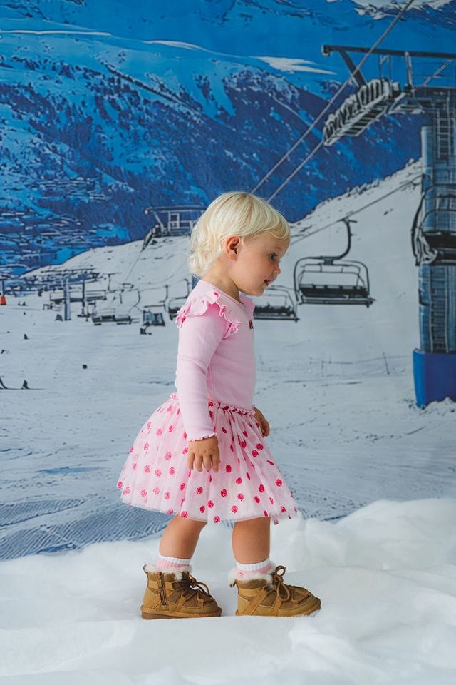 Girls dress by Huxbaby with rose embroidery, featuring a delicate tulle fabric and a soft, stylish design.
