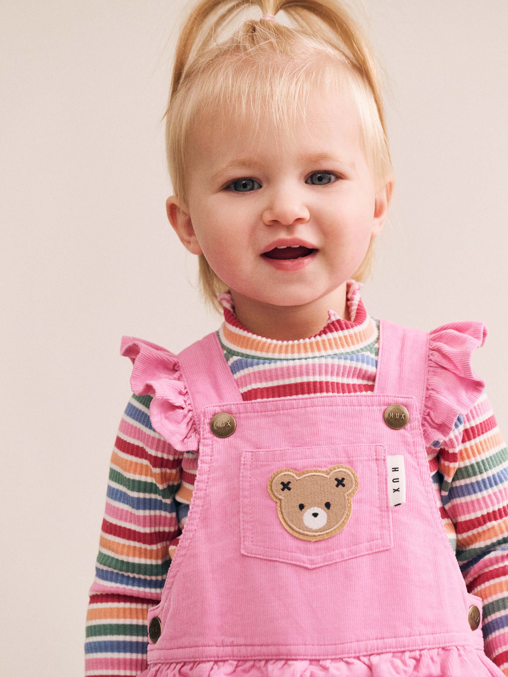 Huxbaby girls' Tutti Frutti Stripe Rib Skivvy top featuring colorful striped pattern and soft ribbed fabric.