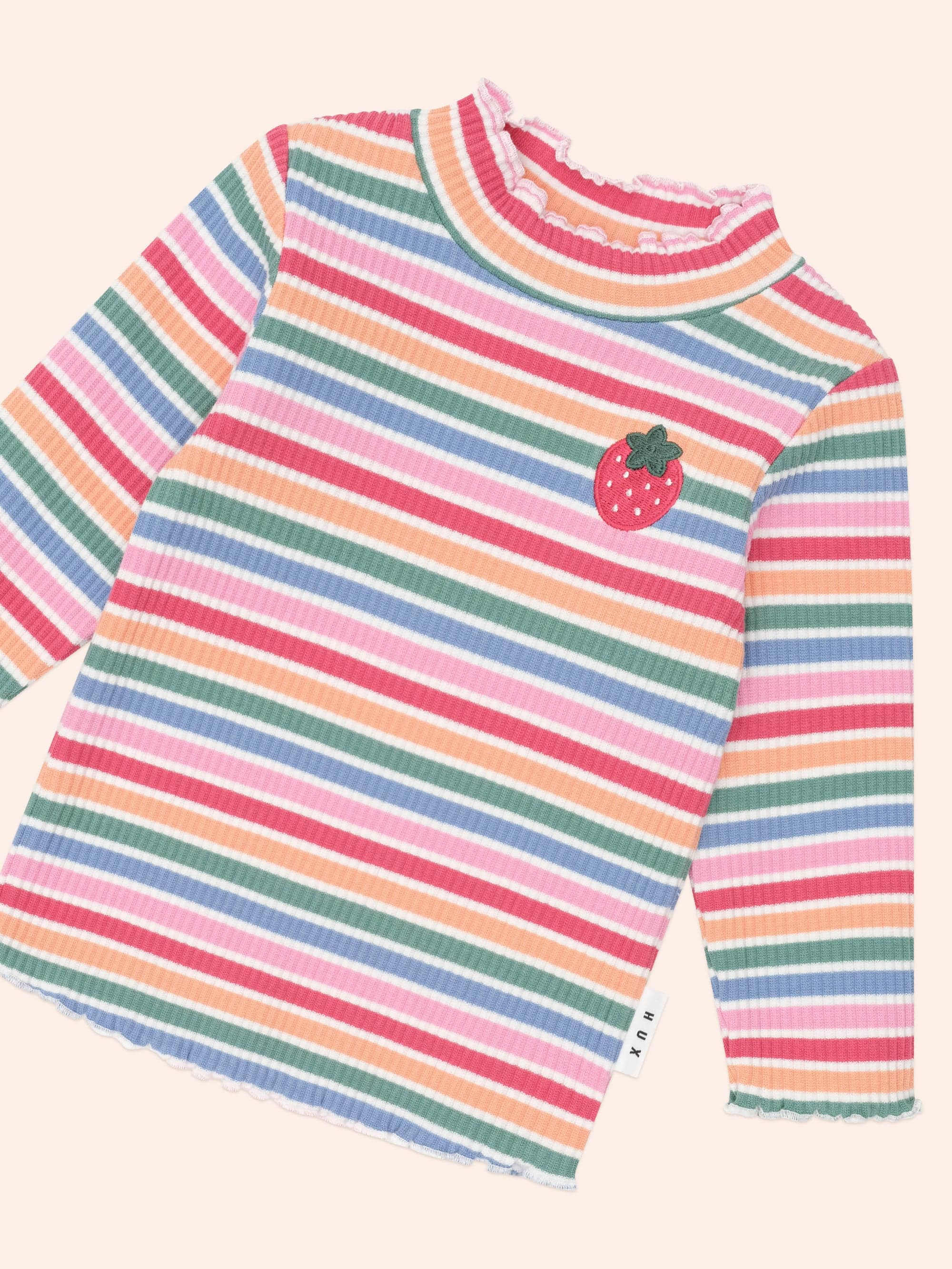 Girls' Tutti Frutti Stripe Rib Skivvy by Huxbaby, featuring colorful striped design and comfortable ribbed fabric.