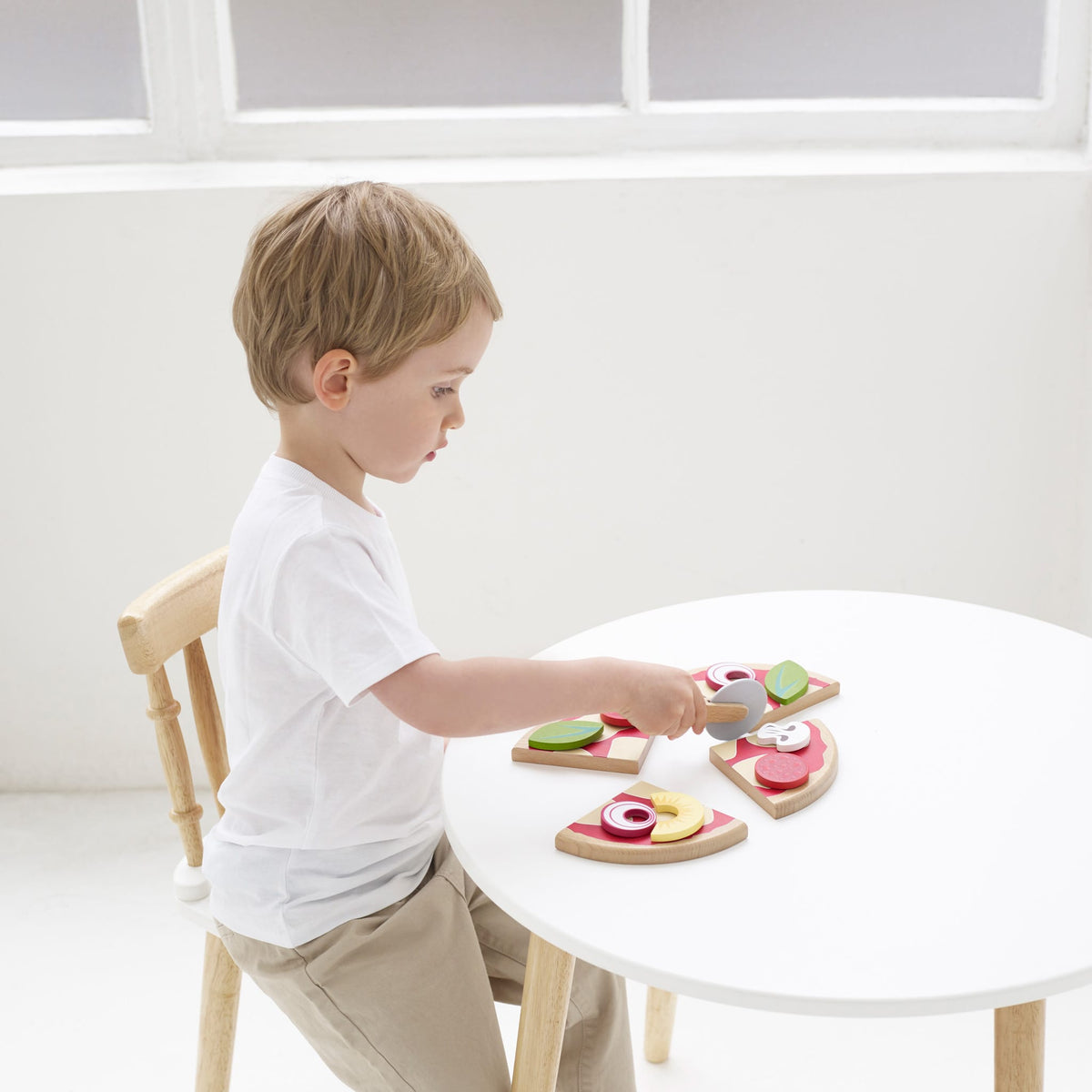 Le Toy Van Create Your Own Pizza toy set with colorful wooden pizza toppings
