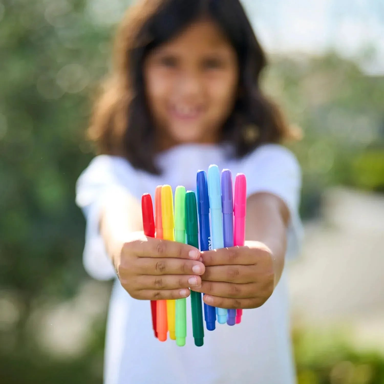 Ooly Fabric Doodlers Markers for kids' toys, colorful markers on a white background, ideal for fabric art and creative projects.