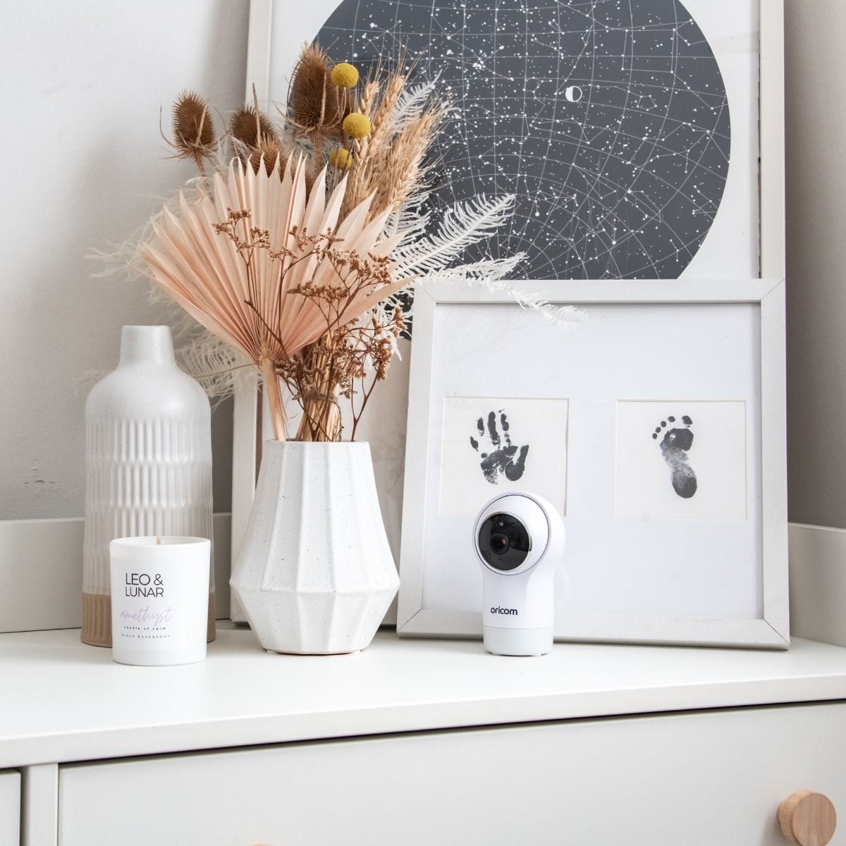 Oricom 5-inch Smart HD Nursery Pal Glow+ baby monitor showing a sleek device with a display screen for baby care monitoring