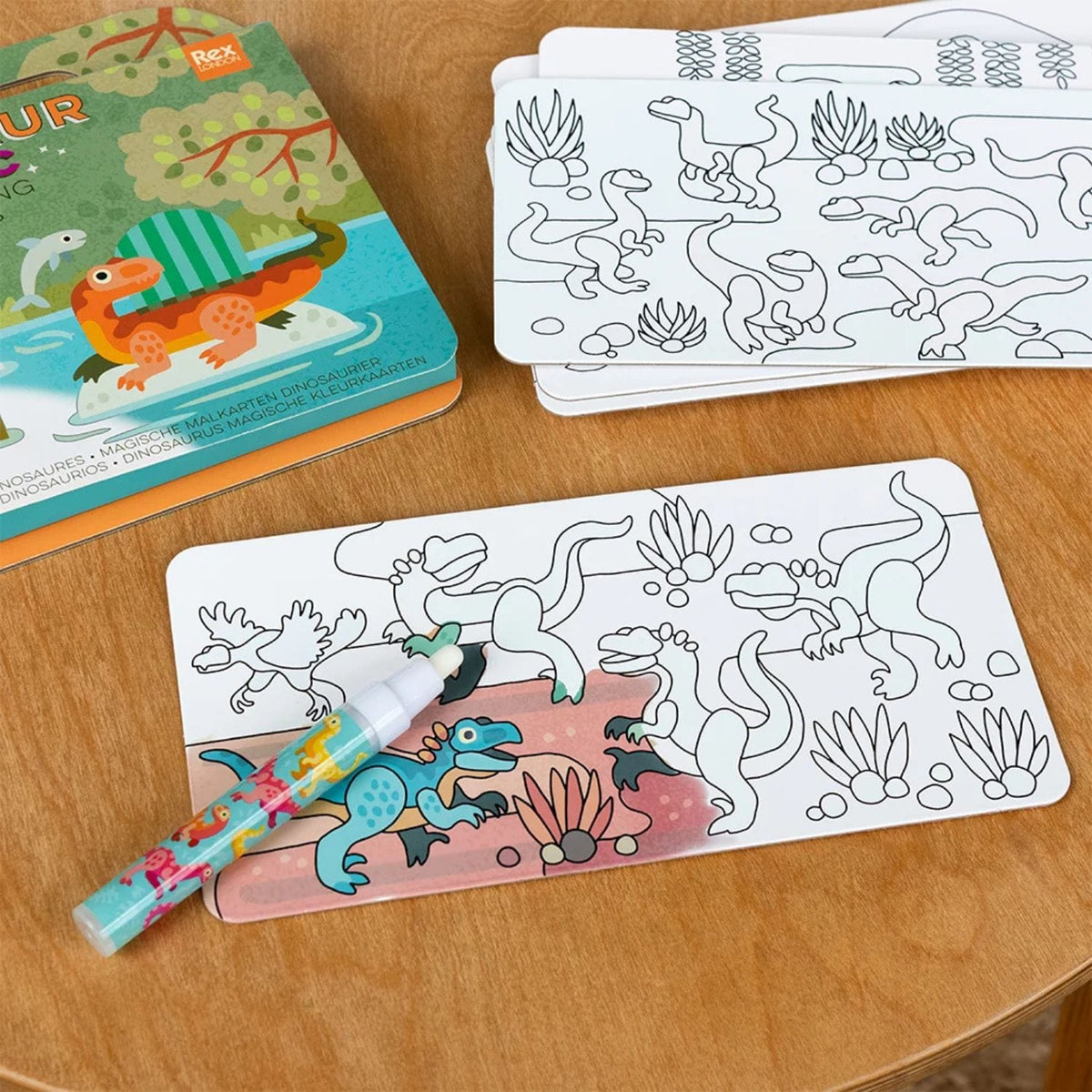 Rex London Magic Water Colouring Cards featuring baby dinosaur illustrations with reusable water painting activity