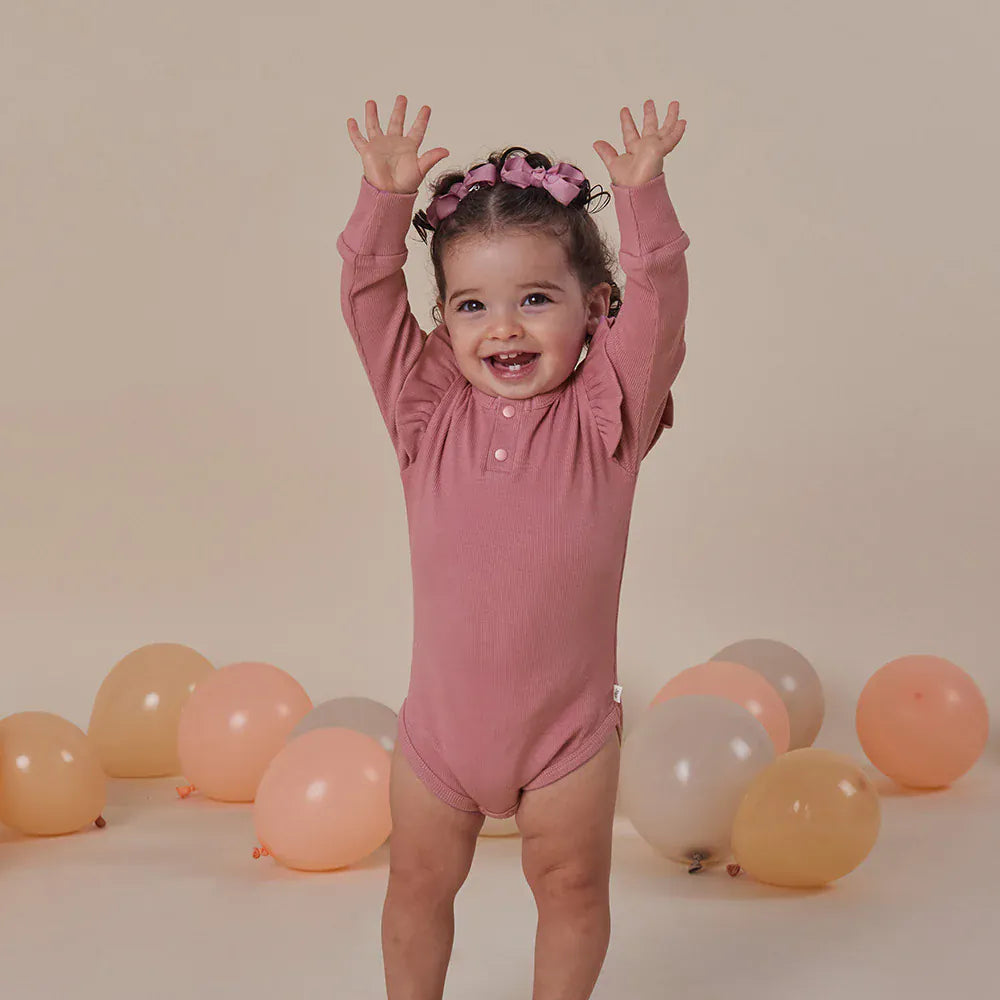 Snuggle Hunny Kids Girls Onesie Jewel Pink Rib Long Sleeve Organic Bodysuit with Frill