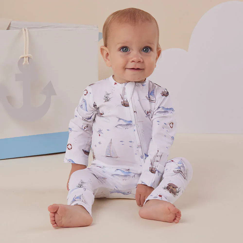 Girls organic Snugglesuit convertible romper by Snuggle Hunny Kids, featuring a colorful sailboat print on a soft onesie.