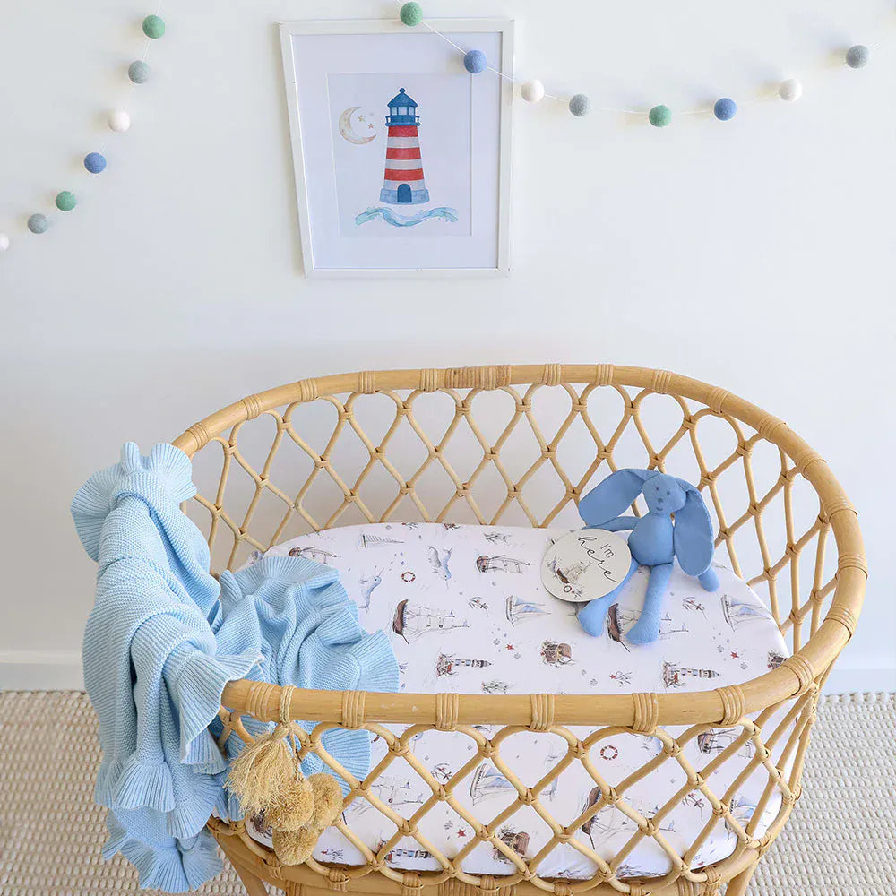 Set Sail organic linen bassinet sheet and change pad cover by Snuggle Hunny Kids, soft and breathable for baby comfort.