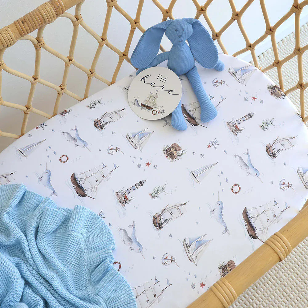 Set Sail organic linen bassinet sheet and change pad cover by Snuggle Hunny Kids, soft and breathable for baby’s comfort.
