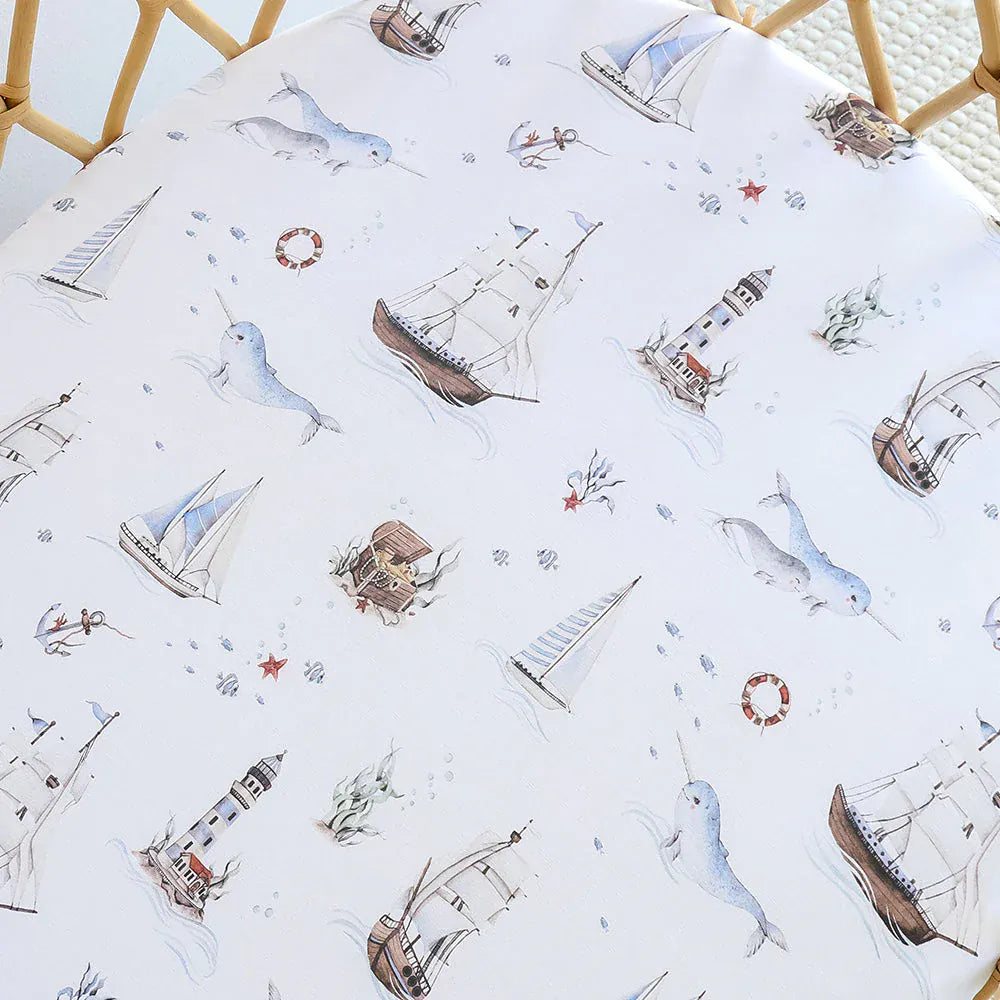 Snuggle Hunny Kids organic linen bassinet sheet and change pad cover with a nautical sail design for baby bedding.