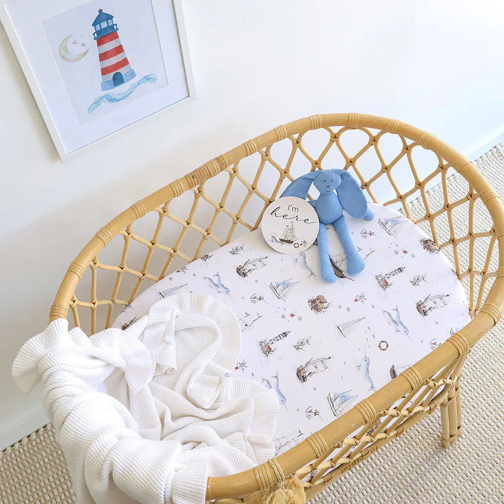Snuggle Hunny Kids Set Sail organic linen bassinet sheet and change pad cover with nautical print, soft and breathable for baby comfort.