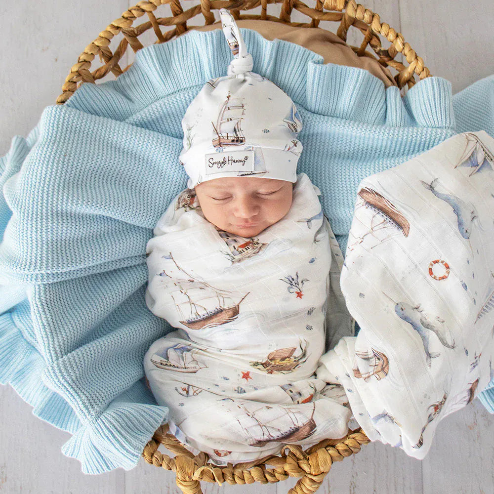 Set Sail Organic Muslin Wrap featuring Snuggle Hunny Kids linen sheets with nautical pattern, soft and breathable for babies.