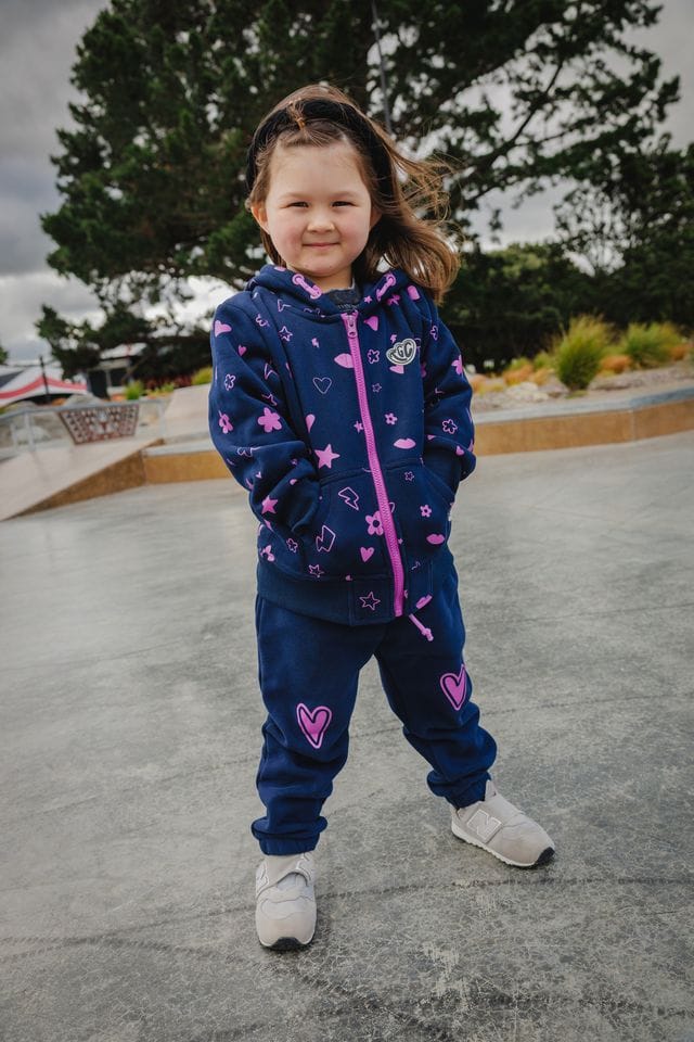 Navy Icons Zip Hood Girls Jumper by The Girl Club, featuring a front zipper and playful icon print, casual and cozy.