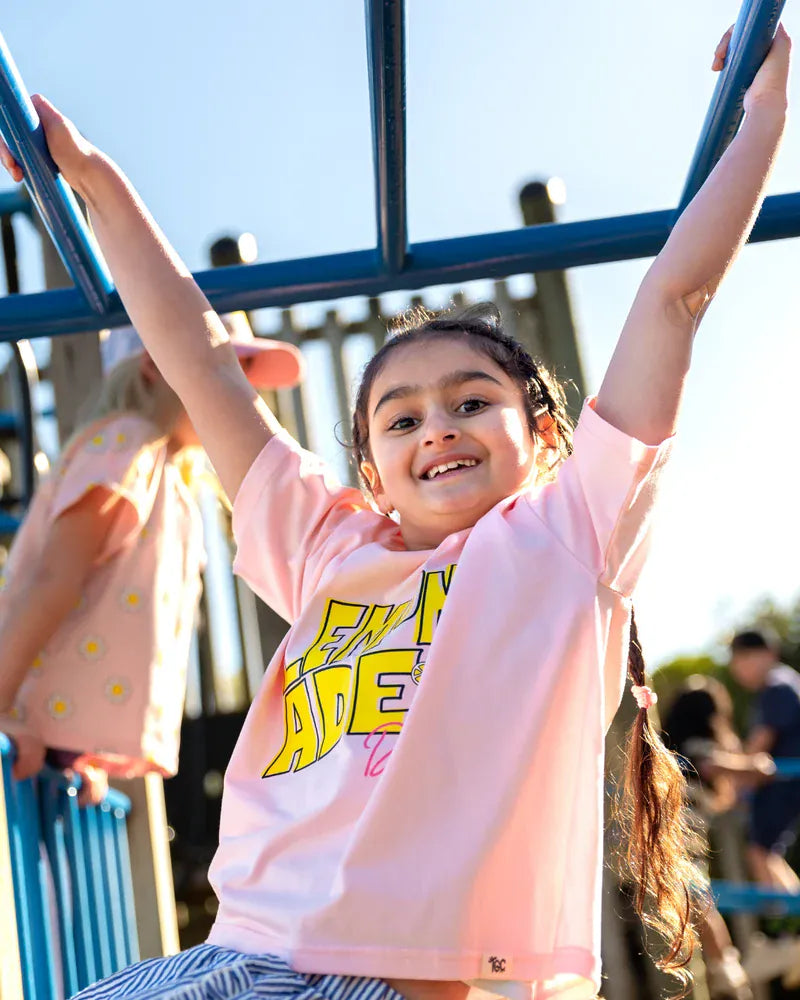 Pink Lemonade Tee for girls by The Girl Club, featuring a soft pink top with playful lemon print and casual style.