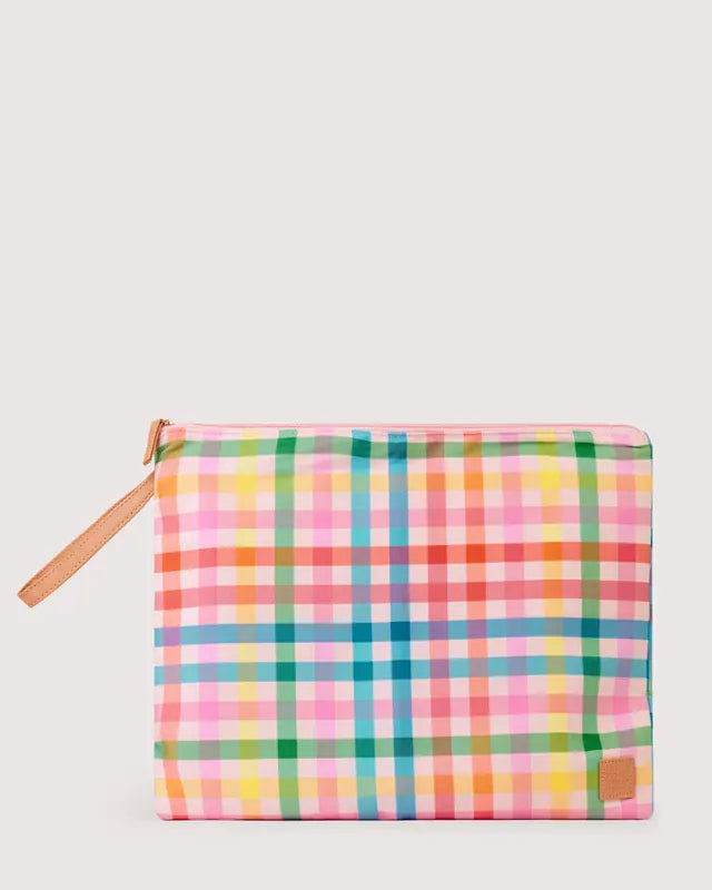 The Somewhere Co. Big Wetbag waterproof pouch in Sugarplum color, showing a fabric bag with a zipper closure and waterproof design.