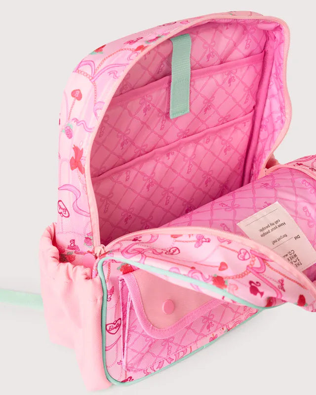 The Somewhere Co. Adventure Backpack shown with multiple compartments, sturdy straps, and outdoor-inspired design.