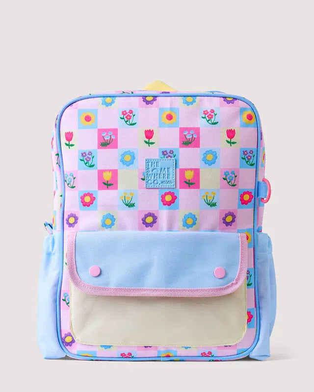 The Adventure Backpack by The Somewhere Co. in Tulip Twirl, showcasing a stylish bag with floral pattern and adjustable straps.