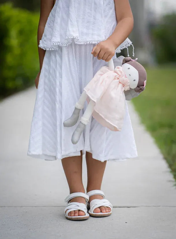Soft light skin doll from Tikiri Collection's Angelina toy line, featuring detailed facial features and soft fabric clothing.
